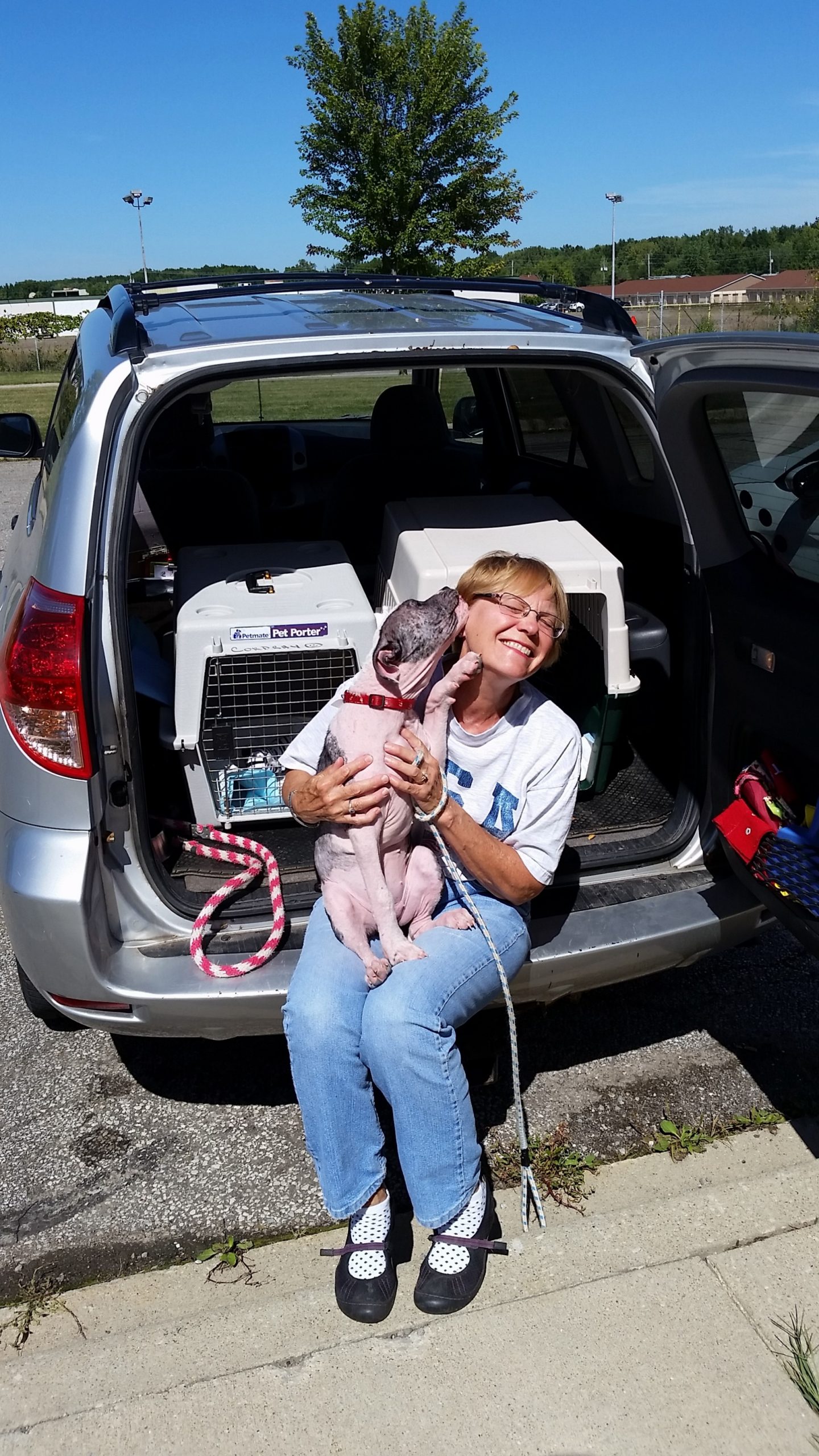 Mary Cordray is the head of our foster program. she is featured here with her foster puppy Izzy.